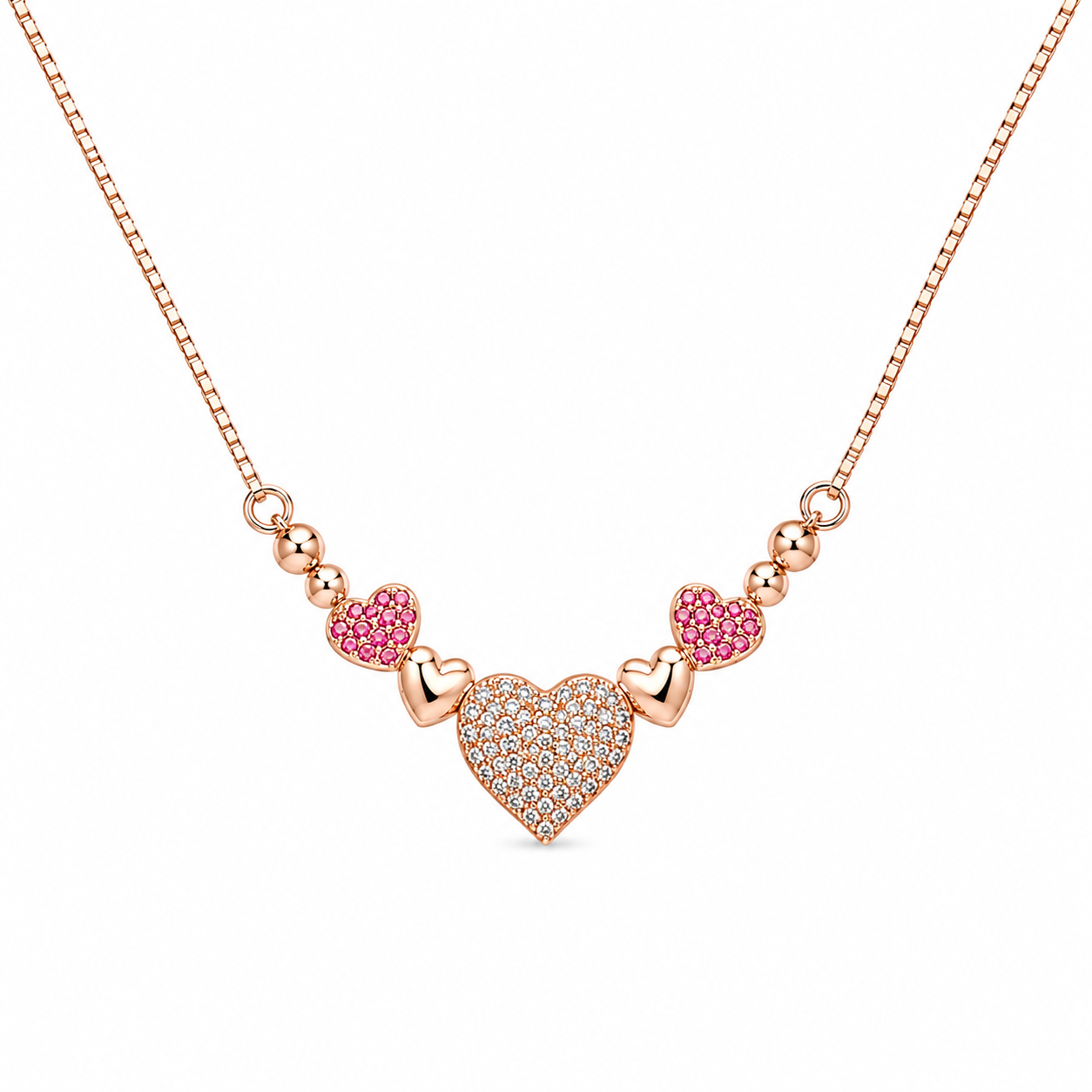 Rose gold heart necklace featuring a sparkling crystal heart with ruby-red crystal heart accents on a delicate chain.