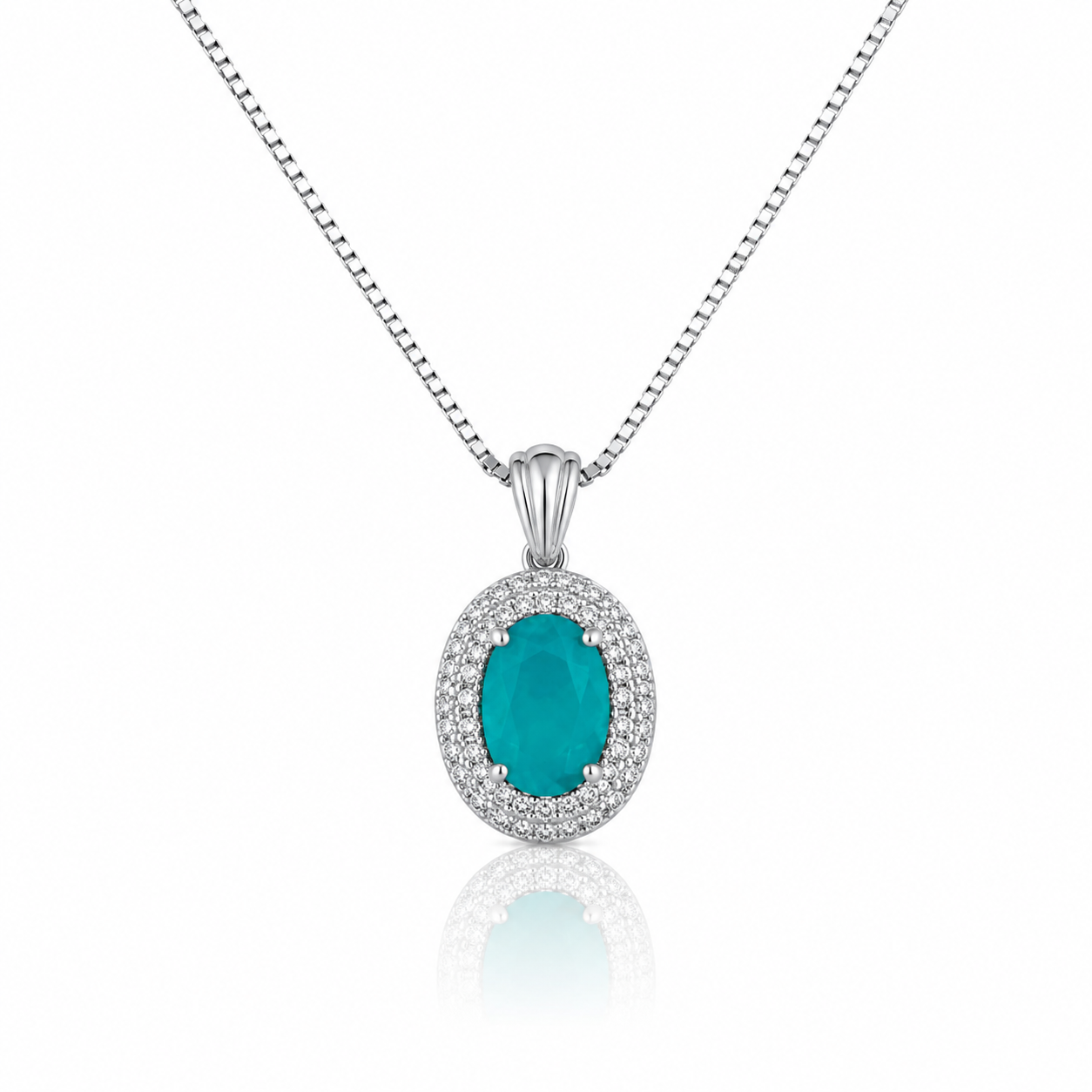 Elegant silver pendant necklace featuring an emerald-green oval crystal surrounded by sparkling zircon stones on a delicate box chain.